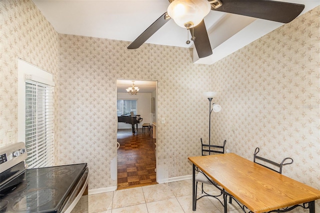 office space featuring ceiling fan with notable chandelier and light tile patterned flooring