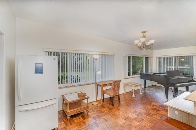 interior space featuring a notable chandelier and parquet floors