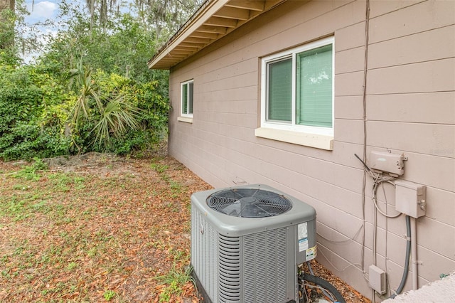 view of side of home featuring cooling unit