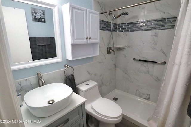 bathroom with vanity, toilet, and curtained shower