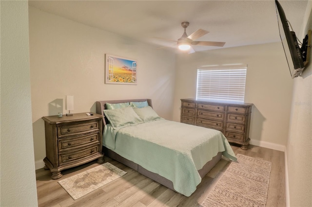 bedroom featuring light hardwood / wood-style flooring and ceiling fan