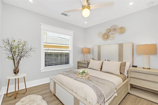 bedroom featuring ceiling fan and light hardwood / wood-style flooring