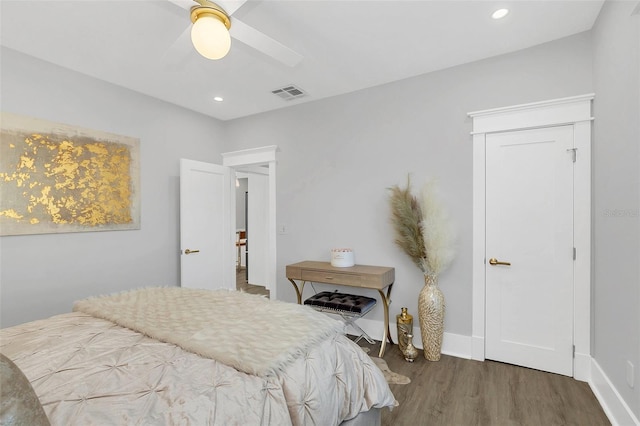 bedroom featuring ceiling fan and dark wood-type flooring