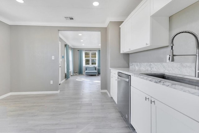 kitchen featuring white cabinetry, dishwasher, ornamental molding, and sink