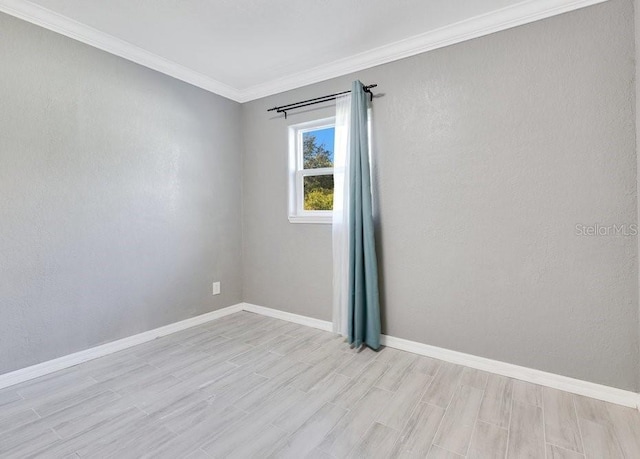 spare room featuring ornamental molding