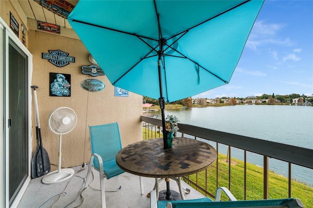 balcony featuring a water view