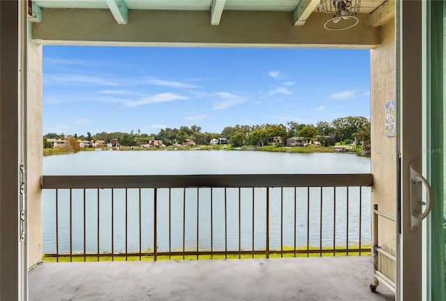 balcony featuring a water view