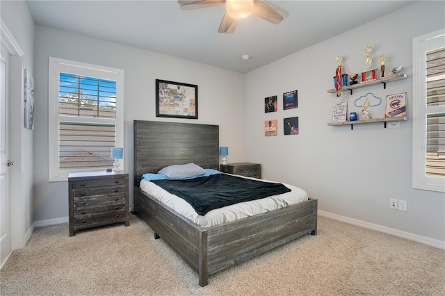 bedroom featuring ceiling fan and light colored carpet