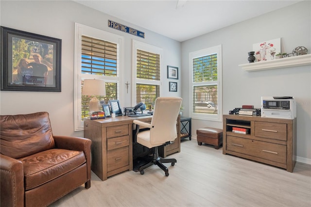 office with light hardwood / wood-style floors