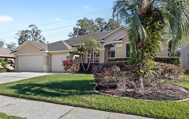 view of front of house featuring a garage and a front lawn