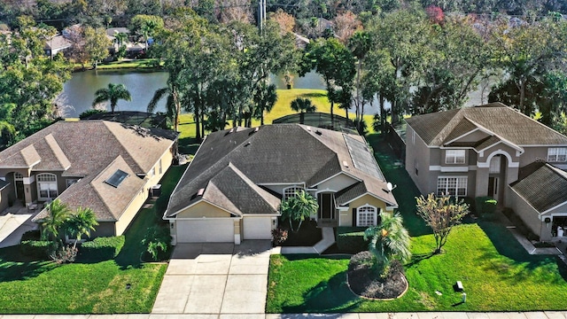 birds eye view of property featuring a water view