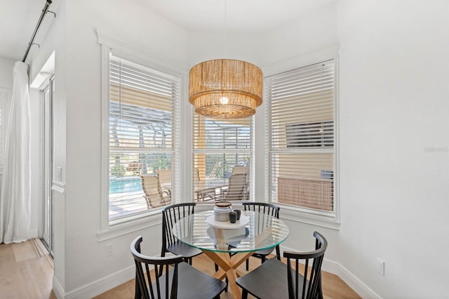 dining space with light wood-type flooring