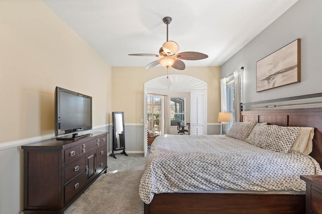 bedroom with ceiling fan and light colored carpet