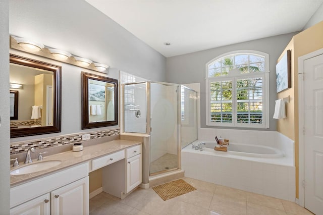 bathroom featuring vanity, decorative backsplash, tile patterned flooring, and plus walk in shower