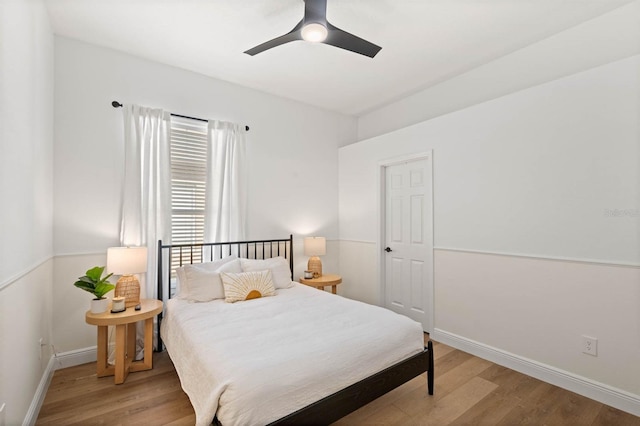 bedroom featuring light hardwood / wood-style floors and ceiling fan