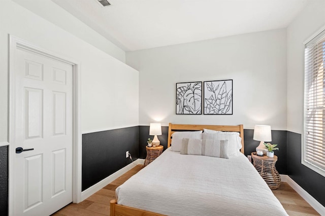 bedroom featuring light wood-type flooring