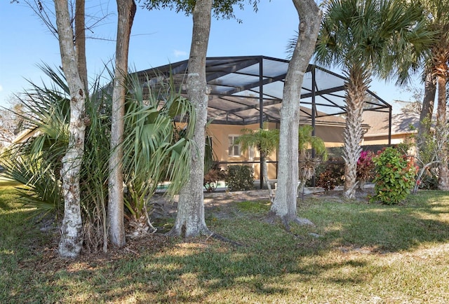 view of yard featuring glass enclosure