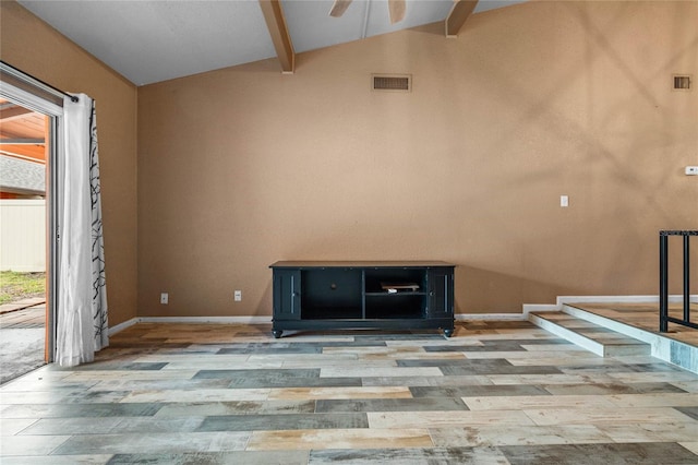 unfurnished living room featuring ceiling fan, vaulted ceiling with beams, and light wood-type flooring