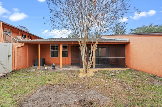 back of property featuring central AC and a patio