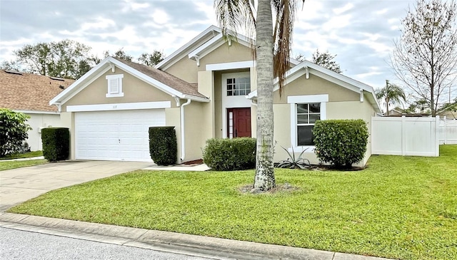 view of front of house with a front yard and a garage