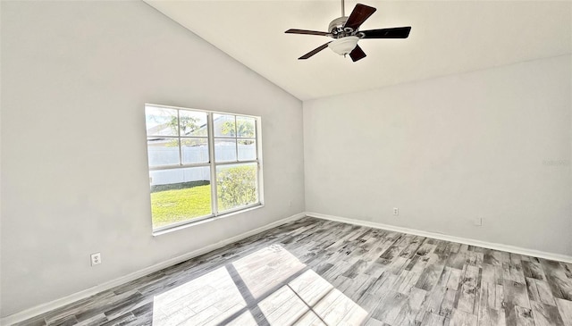 empty room with light hardwood / wood-style floors, high vaulted ceiling, and ceiling fan