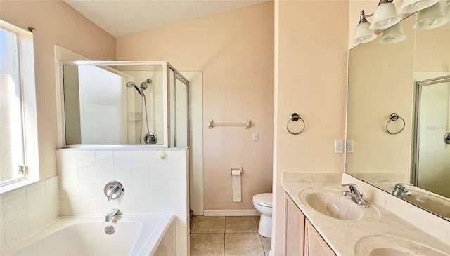 full bathroom with tile patterned floors, toilet, lofted ceiling, and independent shower and bath