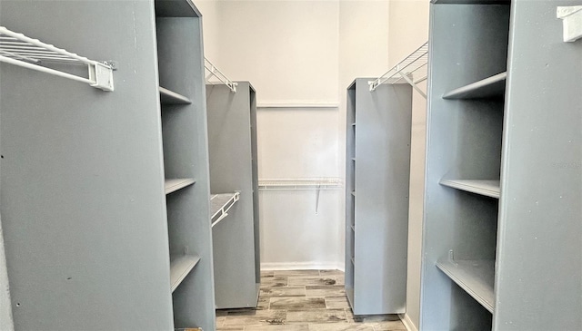 spacious closet featuring light wood-type flooring