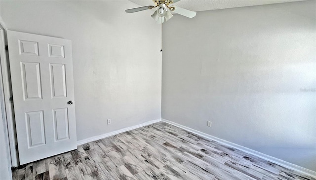 unfurnished room featuring ceiling fan and light hardwood / wood-style flooring