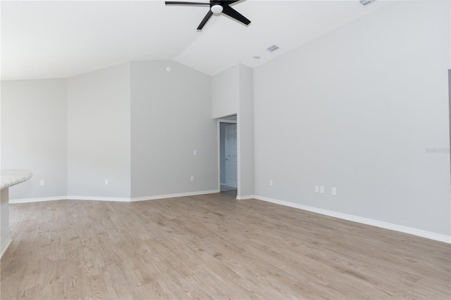 unfurnished living room with ceiling fan, light hardwood / wood-style flooring, and vaulted ceiling