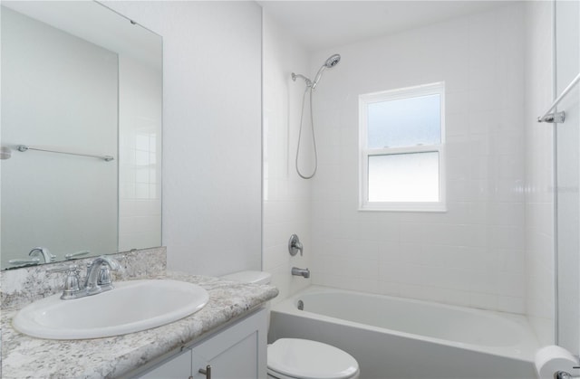 full bathroom with toilet, vanity, and bathing tub / shower combination