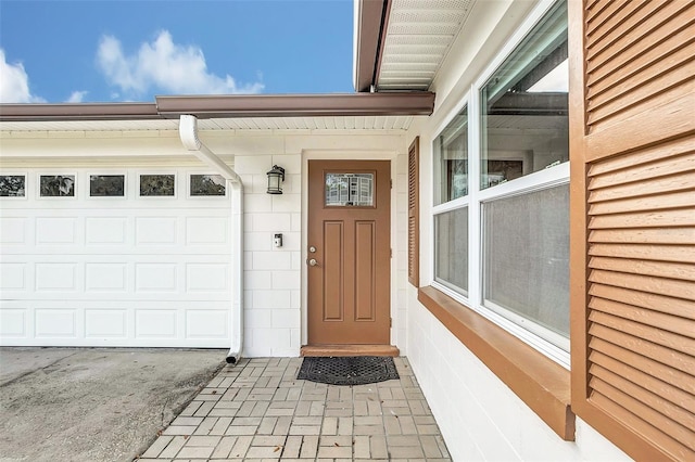 doorway to property featuring a garage