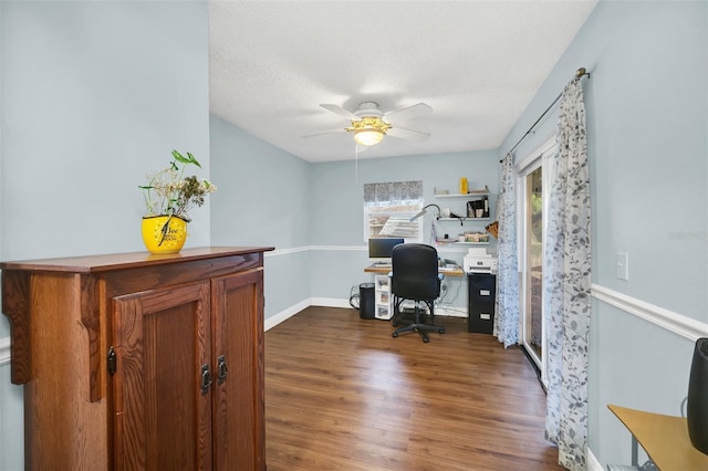 office with ceiling fan, dark hardwood / wood-style floors, and a textured ceiling