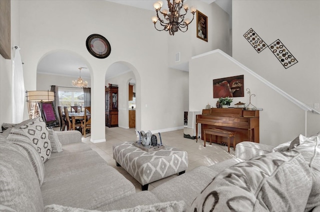 living room featuring light tile patterned floors, a high ceiling, and a notable chandelier