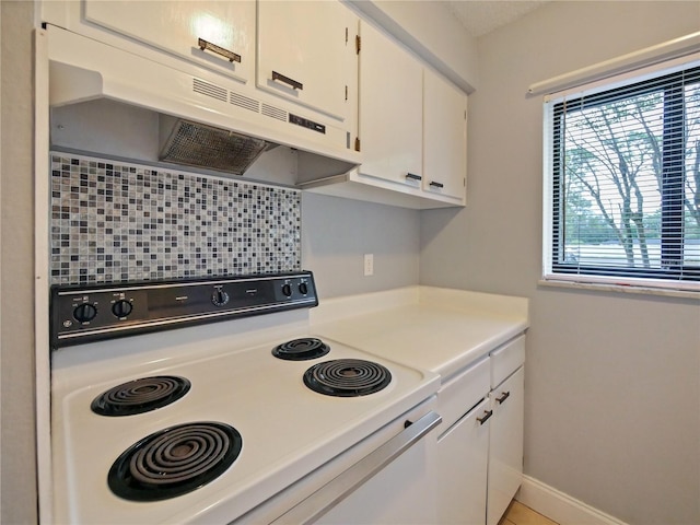 kitchen featuring electric stove, white cabinetry, and tasteful backsplash