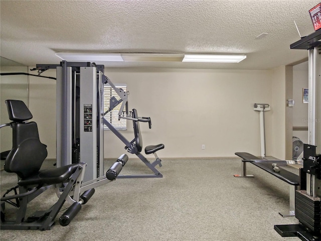 exercise area with a textured ceiling