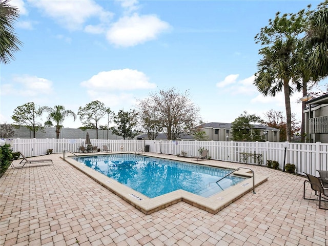 view of swimming pool featuring a patio area