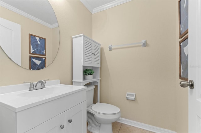 bathroom with ornamental molding, vanity, tile patterned floors, and toilet