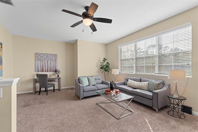 living room featuring carpet floors and ceiling fan