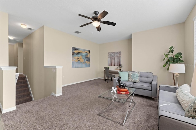 carpeted living room with ceiling fan