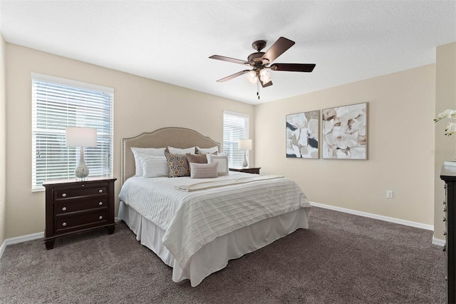 carpeted bedroom featuring a textured ceiling and ceiling fan