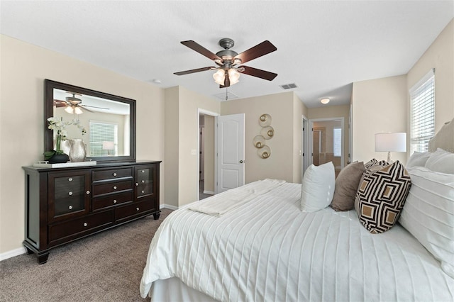 bedroom with ceiling fan and light carpet