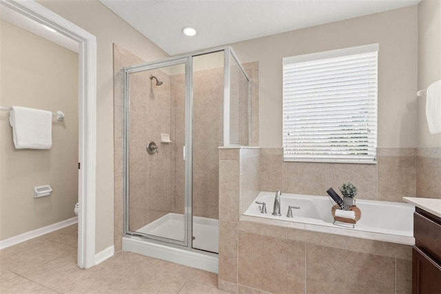 full bathroom with vanity, tile patterned floors, plus walk in shower, and toilet