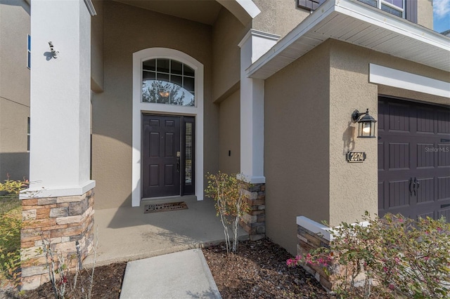 entrance to property featuring a garage