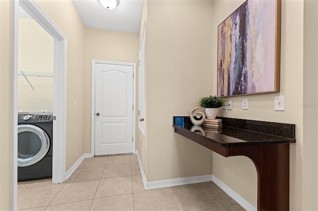 washroom with washer / clothes dryer and light tile patterned floors