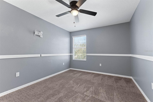 carpeted empty room with a textured ceiling and ceiling fan