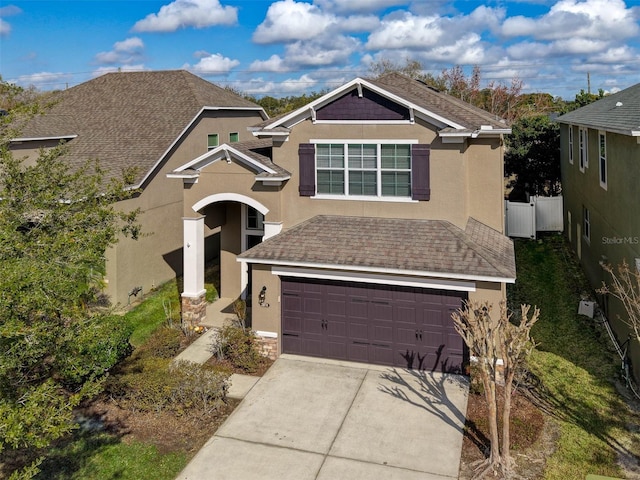 view of front of property with a garage