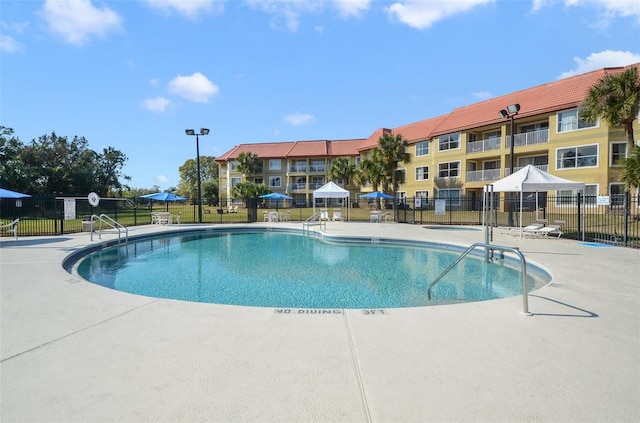 view of swimming pool featuring a patio area