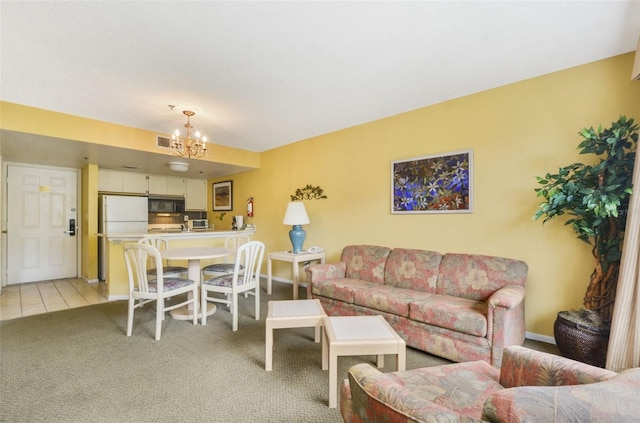 living room with an inviting chandelier and light colored carpet