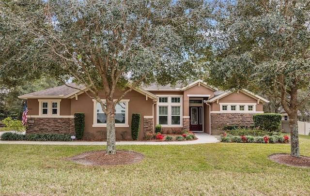 craftsman-style house featuring a front yard