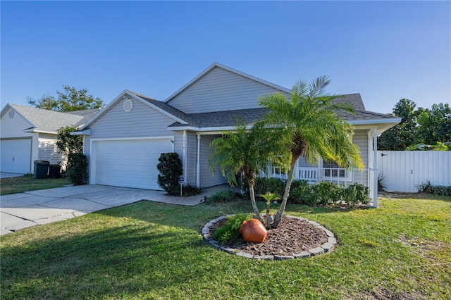 view of front of home with a garage and a front lawn